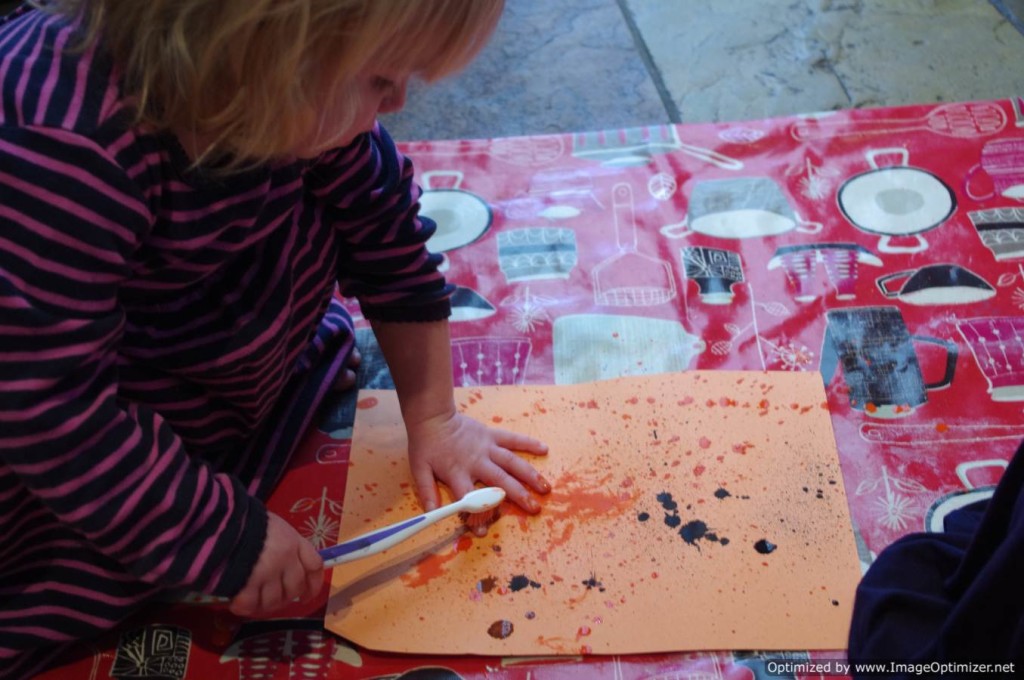 painting with a toothbrush