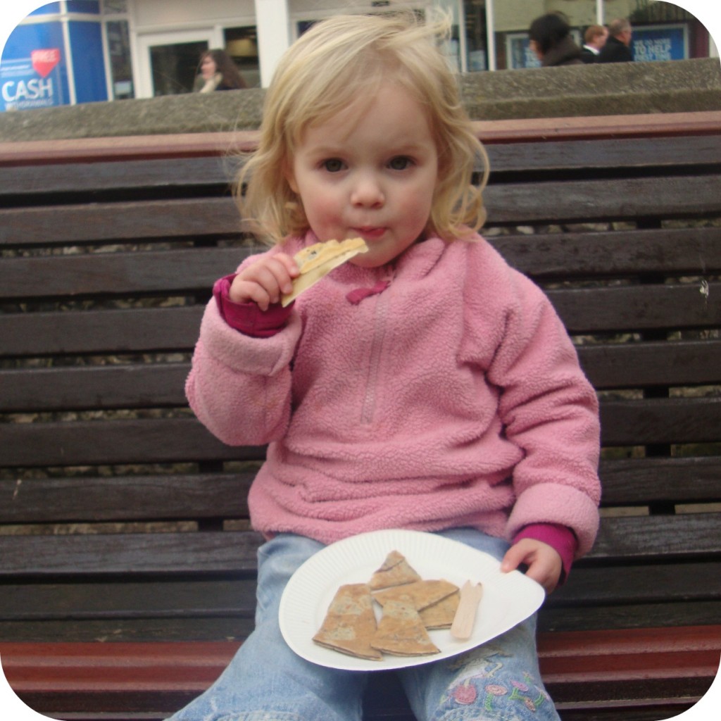 crepe eating crepes on a bench