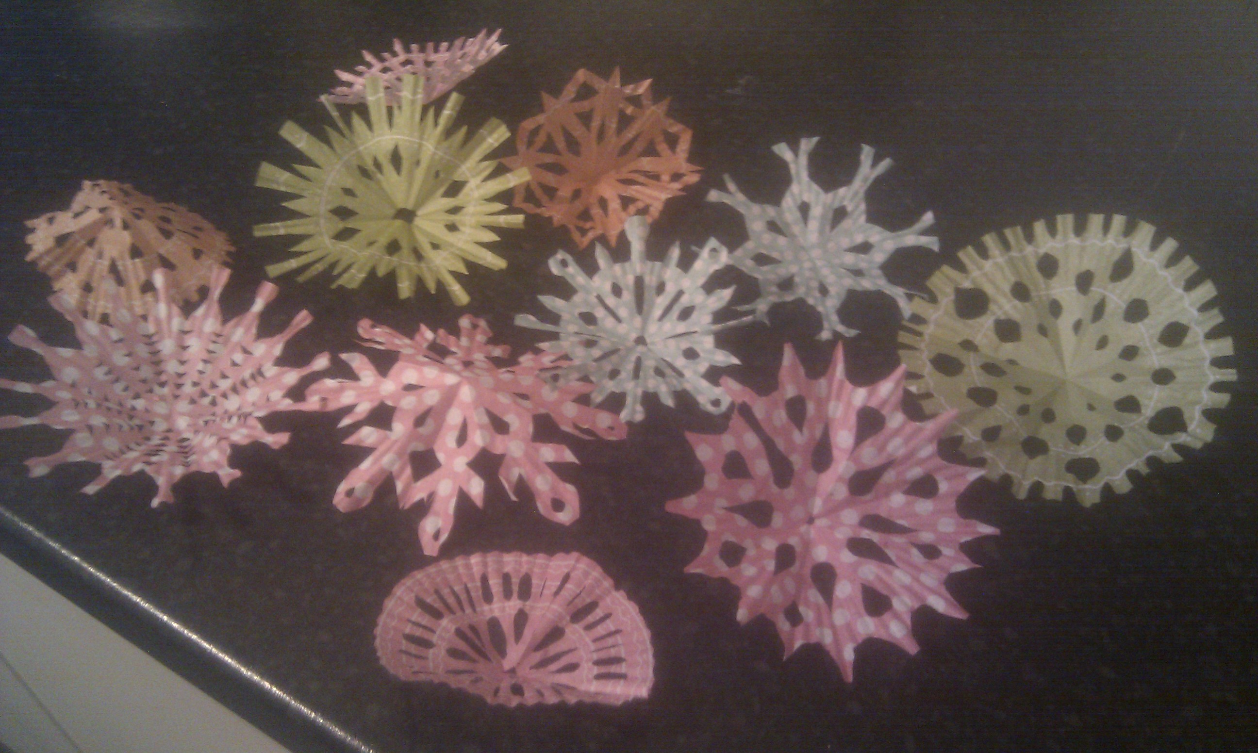 Making snowflakes from cupcake liners